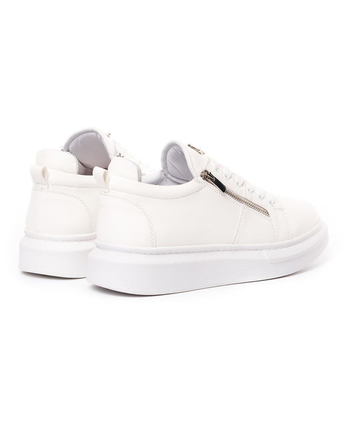 Martin Valen chunky white sneakers with side zipper, rear three-quarter view showing padded collar and platform sole