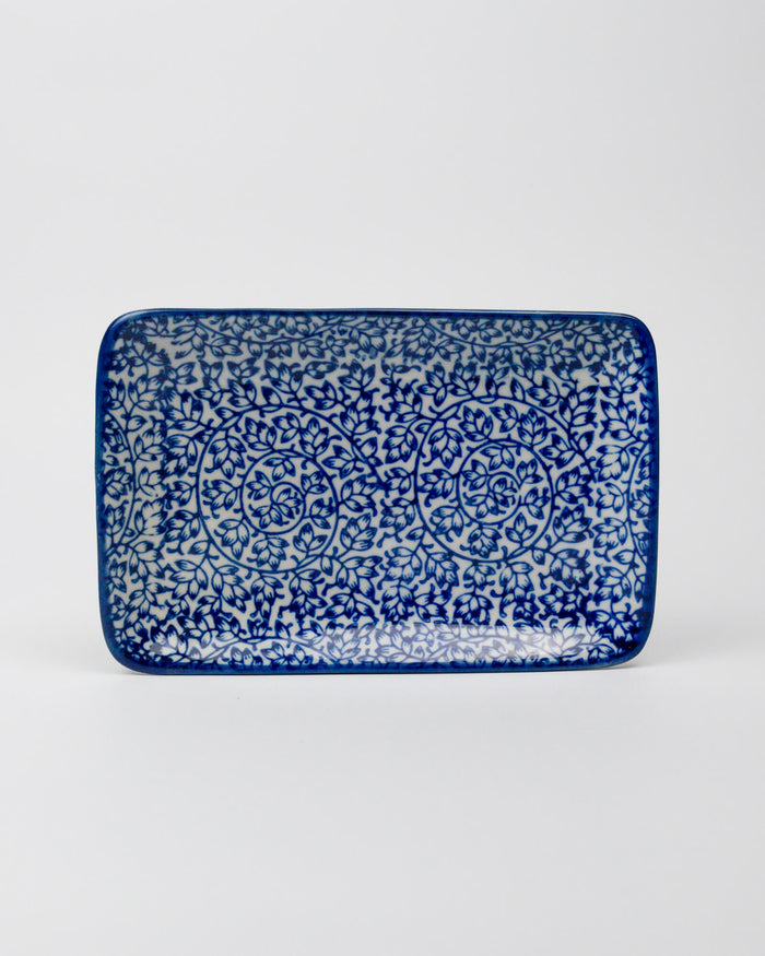 Rectangular ceramic tray with blue and white pattern on a white background