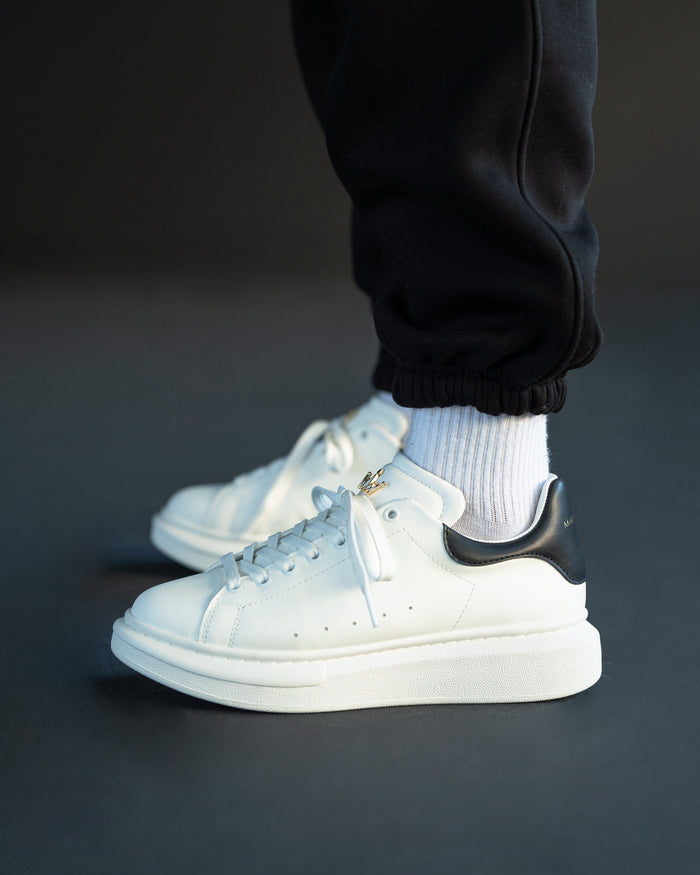 Martin Valen men’s Crowned white-black sneakers, side view showing high sole and laces close-up