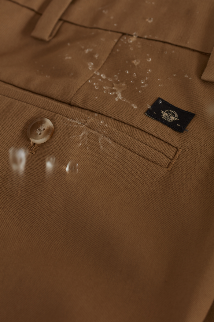 View of model wearing Steelhead Signature Iron Free Khakis, Pleated, Classic Fit with Stain Defender®.