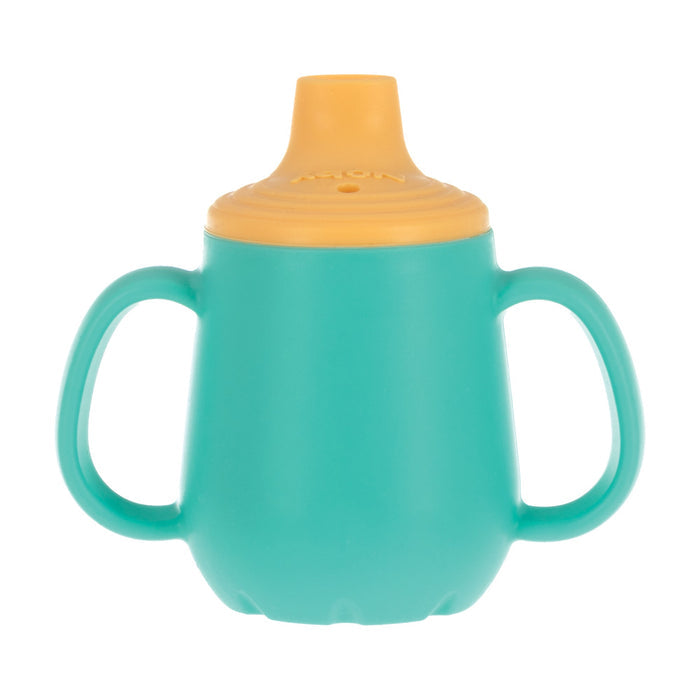 The 2-Handle First Training Cup | Aqua is a turquoise baby cup with dual handles and a yellow spill-proof lid, featuring a free-flow spout for easy grip by little hands.