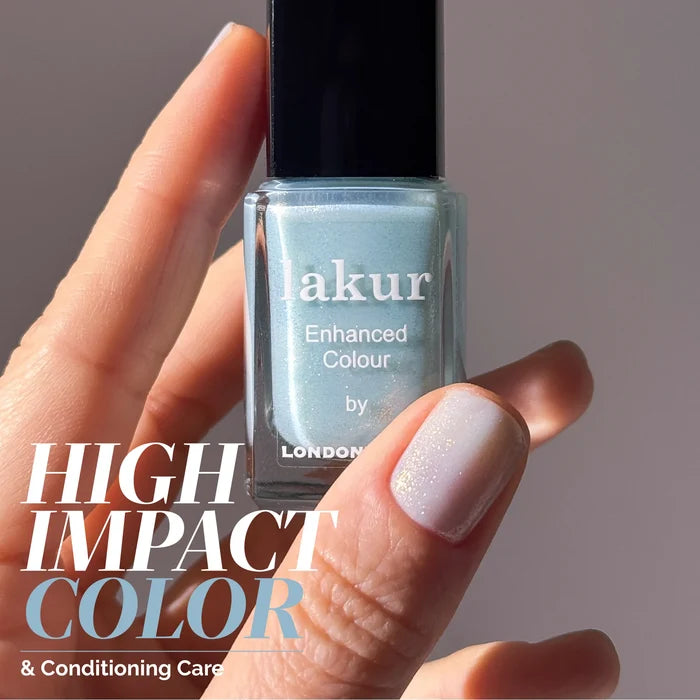 A hand holds a bottle of LONDONTOWN Aegean Aqua nail polish, its aquamarine shade reminiscent of shimmering seawater; one fingernail is painted. Text reads "High Impact Color & Conditioning Care.