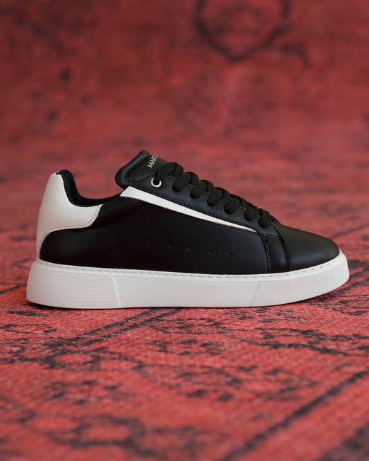 Martin Valen Axino men's black casual sneaker side view with thick white sole, black laces and white heel detail
