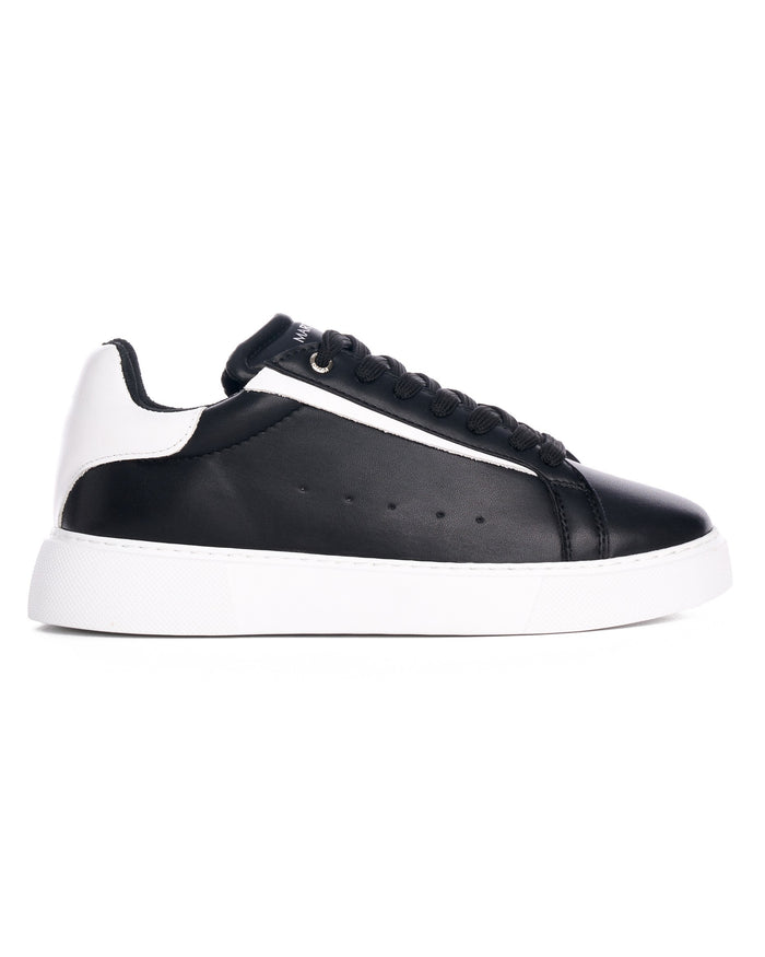 Close-up of Martin Valen Axino black sneaker showing ankle collar and tongue with black laces and visible logo