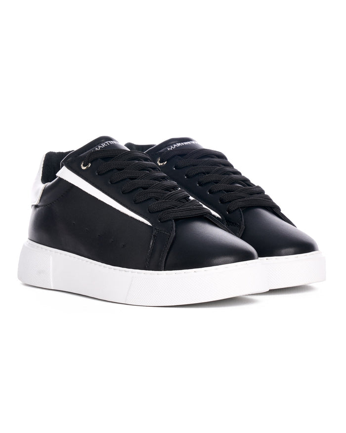 Martin Valen Axino black sneaker side profile on white background with elevated white sole and white side stripe