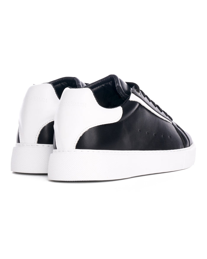 Martin Valen Axino men's black sneakers with white accents, close rear view showing heel panel and white platform sole