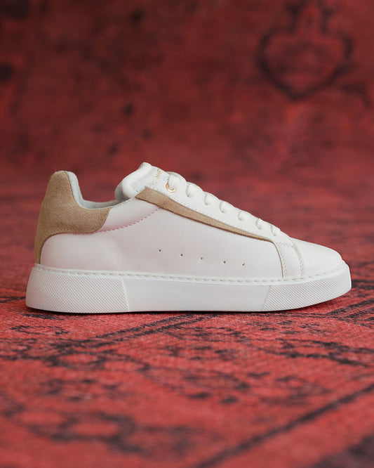 Martin Valen Axino men's casual white sneaker, side profile on red background showing beige suede heel detail.