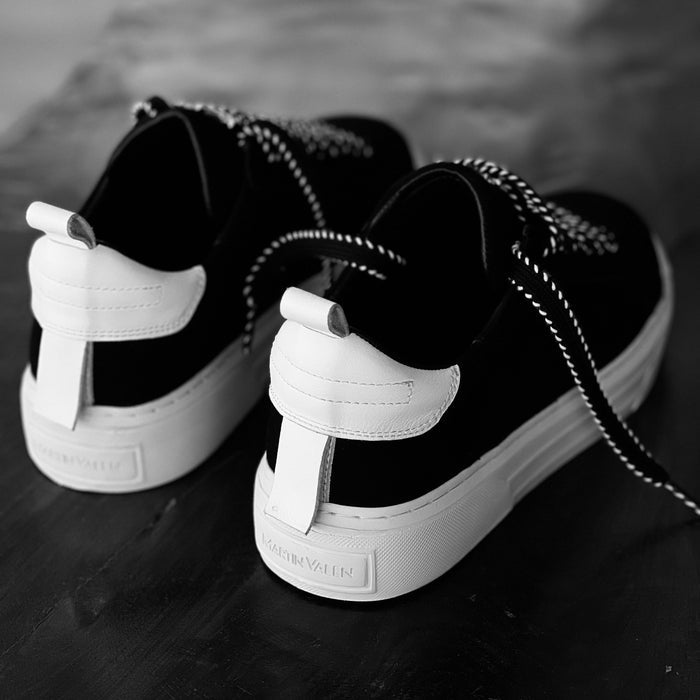 Martin Valen Bobe black suede sneakers, close-up of white heel tab and braided black‑and‑white laces