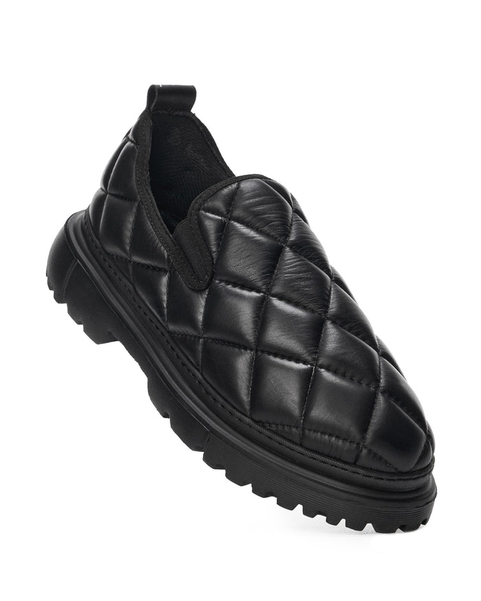 Martin Valen Bold Capitone black shoes, three-quarter front view showing padded toe and rugged lug sole.