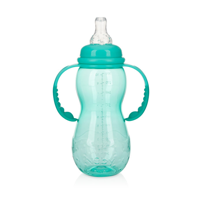 The Bottle-to-Cup Standard Neck Bottle in turquoise features measurement markings, dual side handles, and a clear soft silicone anti-colic spout, shown standing upright on a white background.