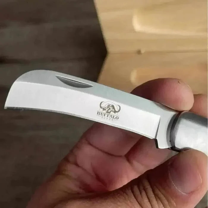 Buffalo River Biltong Tjom Knife with sharp curved stainless steel blade and sturdy laminate wood handle for biltong slicing