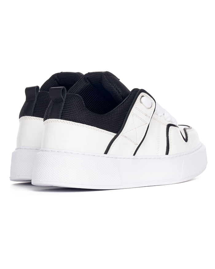 Martin Valen chunky white sneakers with black line and tongue, close rear angle showing heel tab