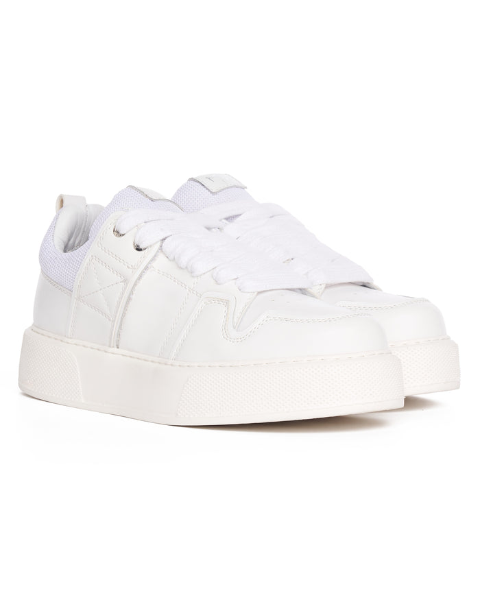Martin Valen bulky white sneakers, close-up of toe and laces with textured platform sole visible