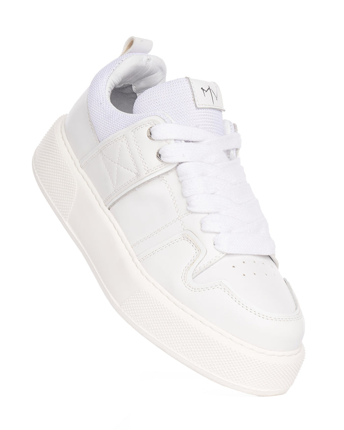 Martin Valen bulky white sneakers, top close-up showing laces, stitched panels and 'MV' logo on the tongue