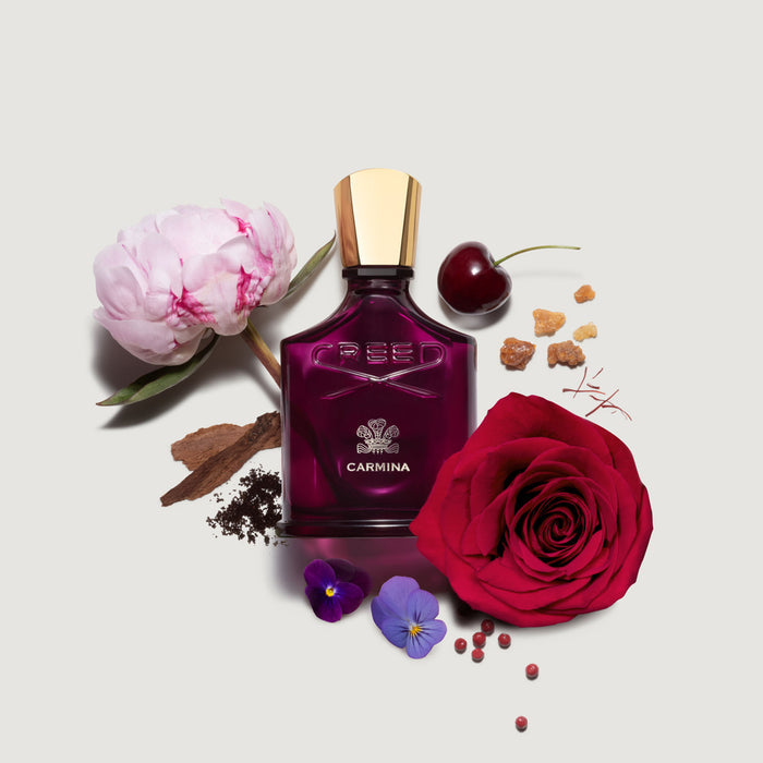 Creed Carmina Perfume with Rose de Mai, Peony, Saffron and Cherry Ingredients - Flat Lay | Creed Fragrances