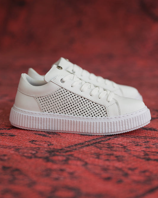 Martin Valen white sneakers side view with mesh cutout upper and ribbed platform sole