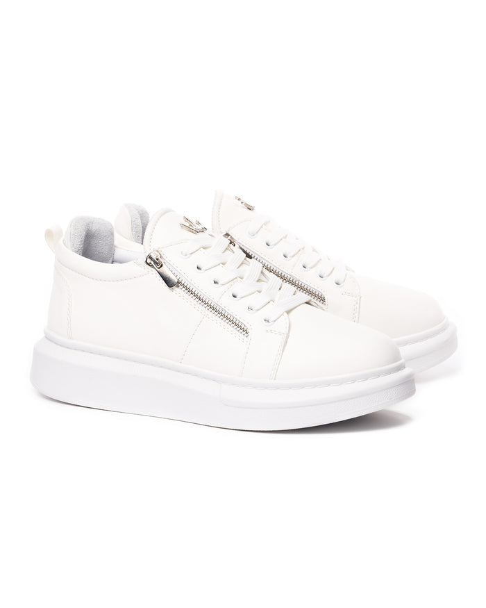 Pair of Martin Valen white chunky designer sneakers in three-quarter view with laces and visible silver side zippers