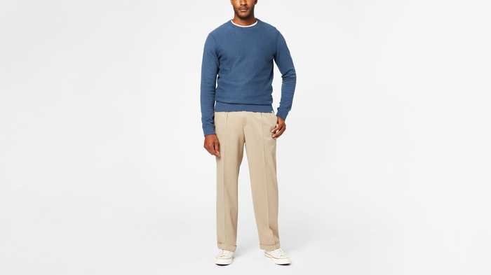 View of model wearing Khaki Comfort Khakis, Pleated, Relaxed Fit.