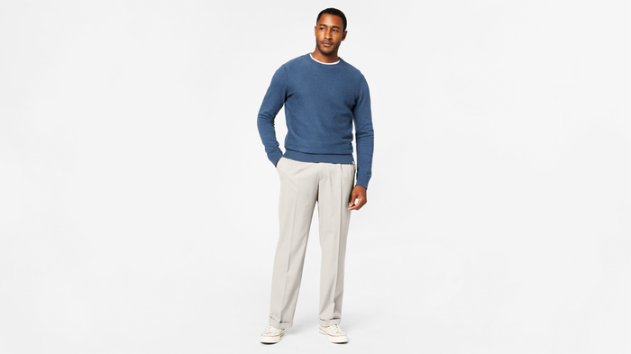 View of model wearing Porcelain Khaki Comfort Khakis, Pleated, Relaxed Fit.