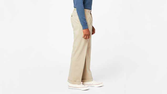 View of model wearing Khaki Comfort Khakis, Pleated, Relaxed Fit.