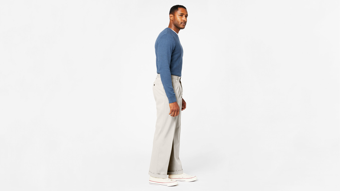 View of model wearing Porcelain Khaki Comfort Khakis, Pleated, Relaxed Fit.