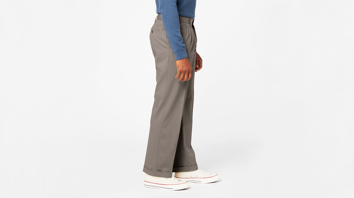 View of model wearing Dark Pebble Comfort Khakis, Pleated, Relaxed Fit.