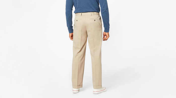View of model wearing Khaki Comfort Khakis, Pleated, Relaxed Fit.