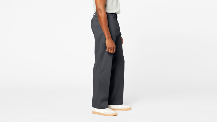 Side view of model wearing Charcoal Comfort Khakis, Relaxed Fit.
