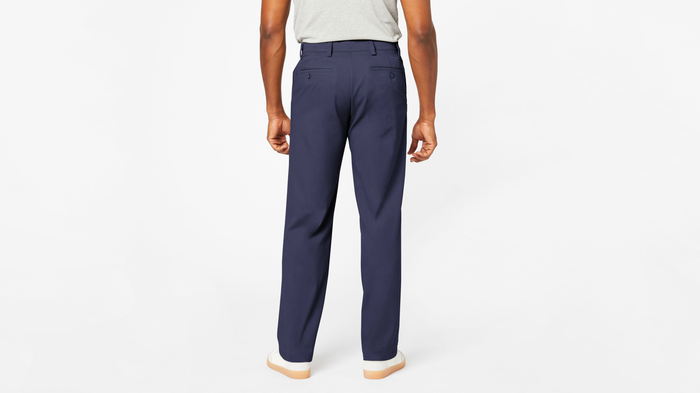 Back view of model wearing Navy Comfort Khakis, Relaxed Fit.