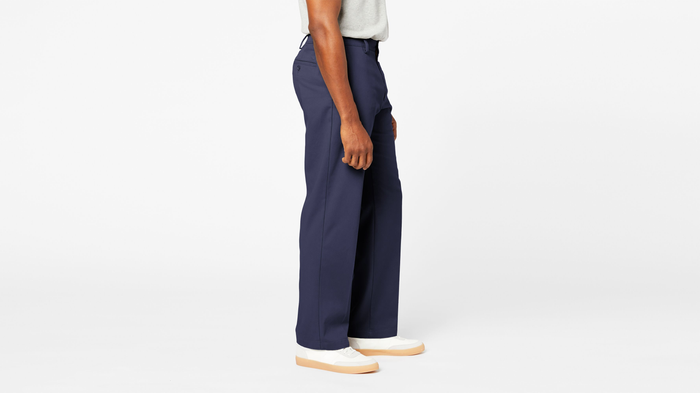 Side view of model wearing Navy Comfort Khakis, Relaxed Fit.