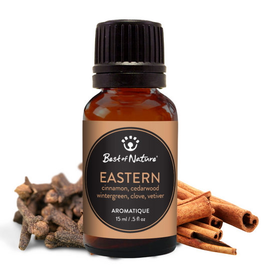 Bottle of 'Best of Nature' Eastern aromatique with cinnamon sticks and other herbs on a white background