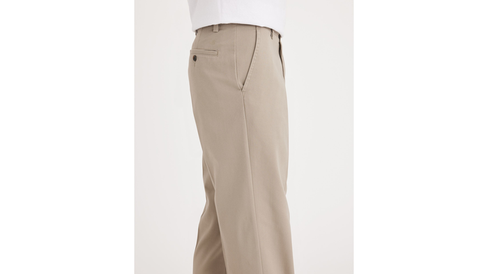 Side view of model wearing Timber Wolf Easy Khakis, Classic Fit (Big and Tall).