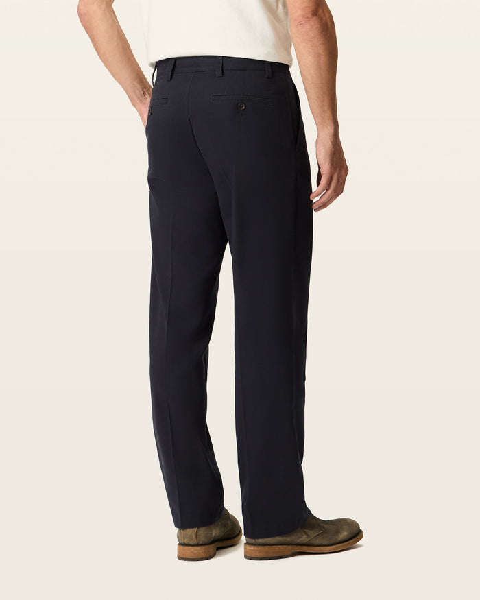 Back view of model wearing Black Easy Khakis, Classic Fit.