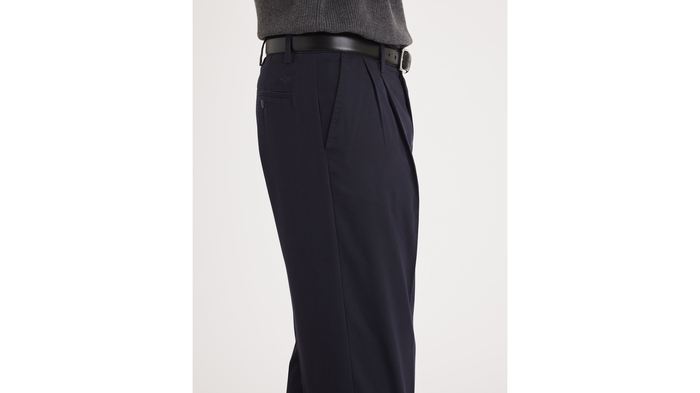 Side view of model wearing Black Easy Khakis, Pleated, Classic Fit (Big and Tall).