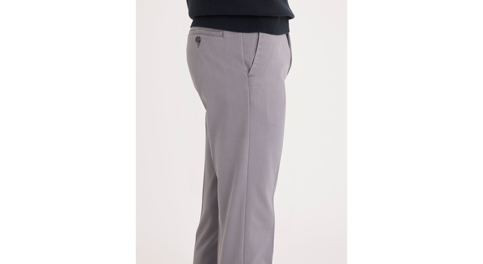 Side view of model wearing Burma Grey Easy Khakis, Slim Fit.