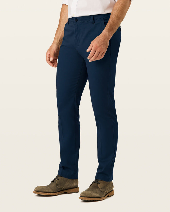Side view of model wearing Navy Easy Khakis, Slim Fit.