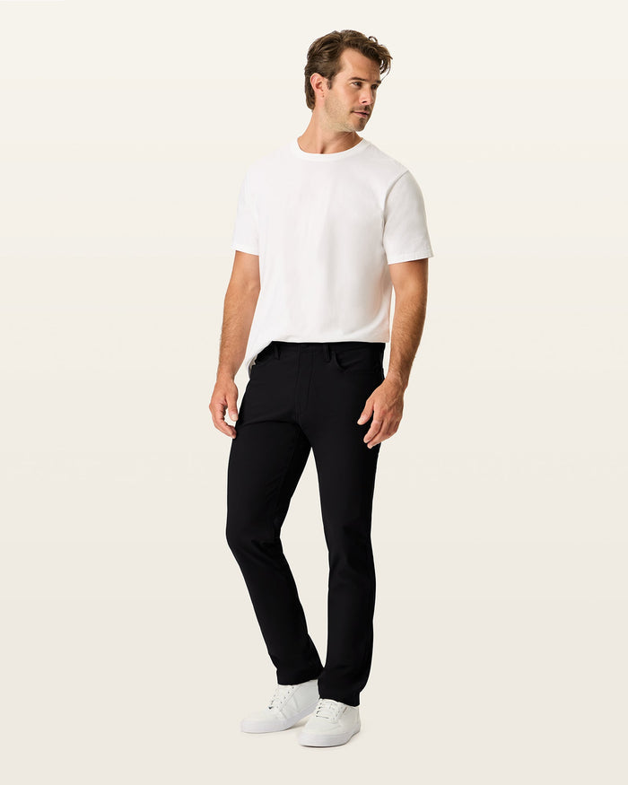 Back view of model wearing Beautiful Black Go Airweave 5-Pocket, Slim Tapered Fit.