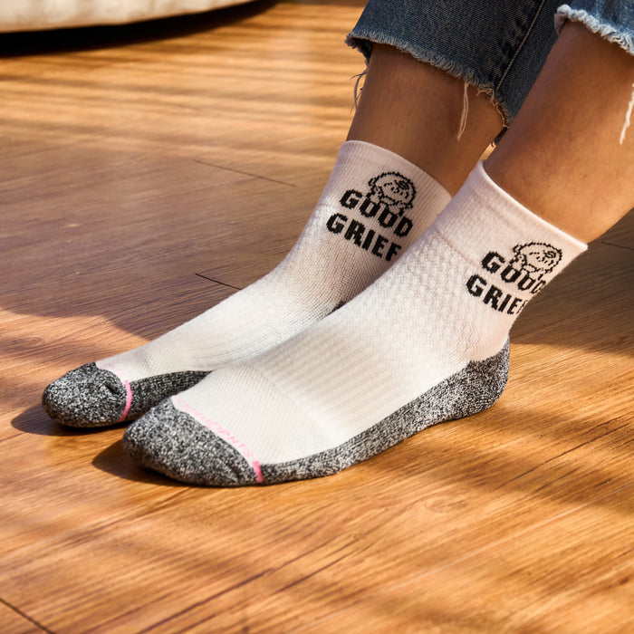 Quarter compression socks with "GOOD GRIEF" text and a graphic, featuring a white and gray color scheme.