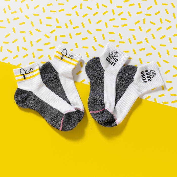 Quarter compression socks featuring a cartoon design and "Good Grief" text, in white and gray colors.