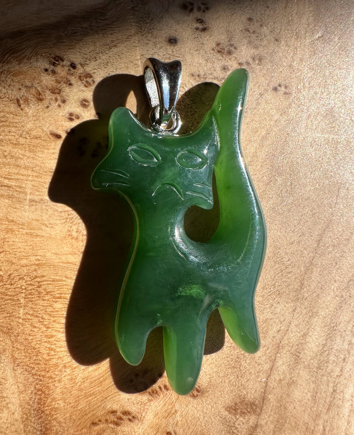 Grumpy Canadian Jade Cat Pendant 34mm glossy green jade shown from a different angle