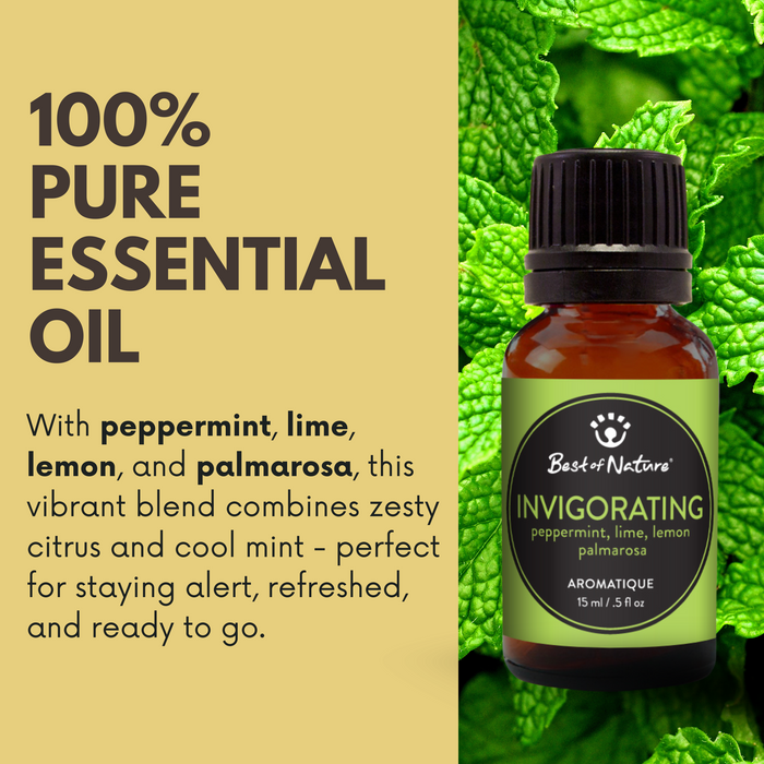 Bottle of invigorating essential oil with green leaves in the background