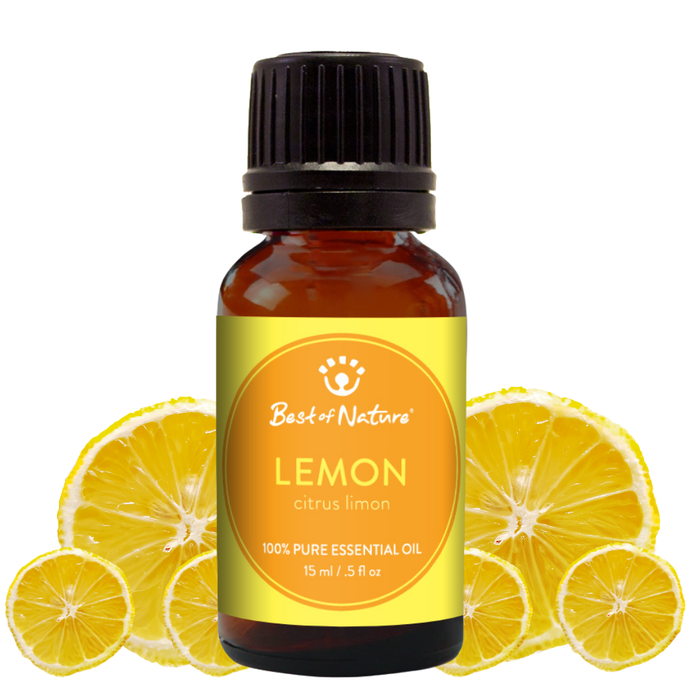 Bottle of lemon essential oil with a yellow label and sliced lemons on a white background