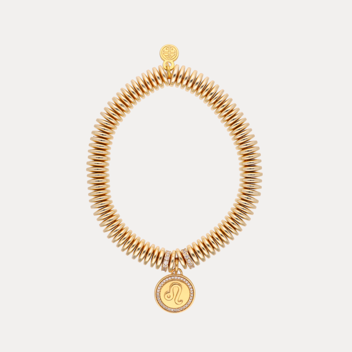 a gold bracelet with a pendant
