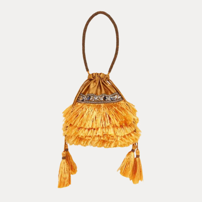 a yellow bag with tassels