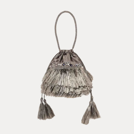 a grey bag with tassels