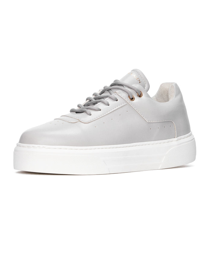 Martin Valen men’s sky gray casual sneaker close-up from side, gray laces with gold eyelets and thick white platform sole