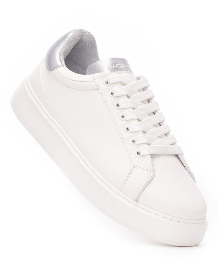 Martin Valen men's white sneakers angled view, silver-branded tongue showing Martin Valen and grey heel lining