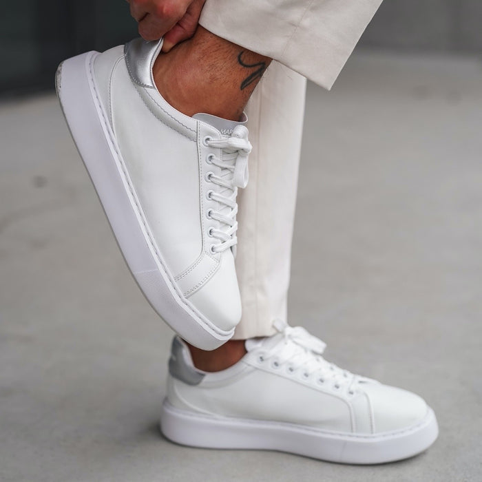 Martin Valen — white men's sneaker with grey heel tab, side view worn on foot with tied laces and chunky white sole