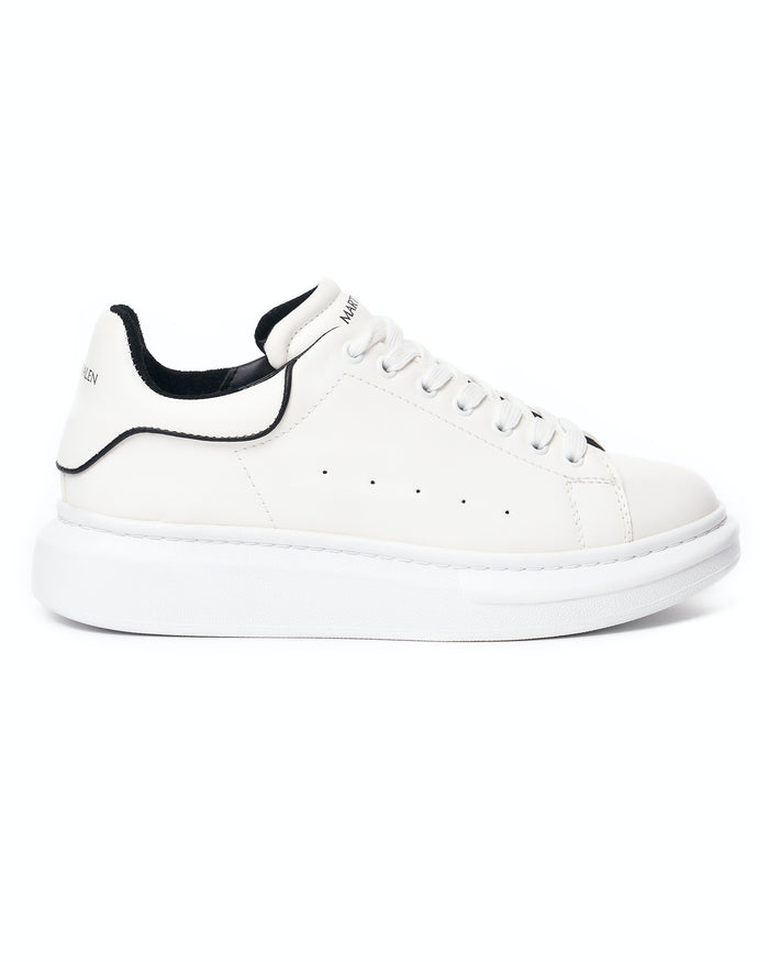 Martin Valen men's chunky white sneaker side profile close-up showing black heel trim and thick white sole