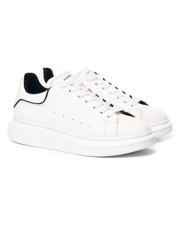 Martin Valen men's chunky white sneakers front three-quarter view with black inner heel and perforated sides